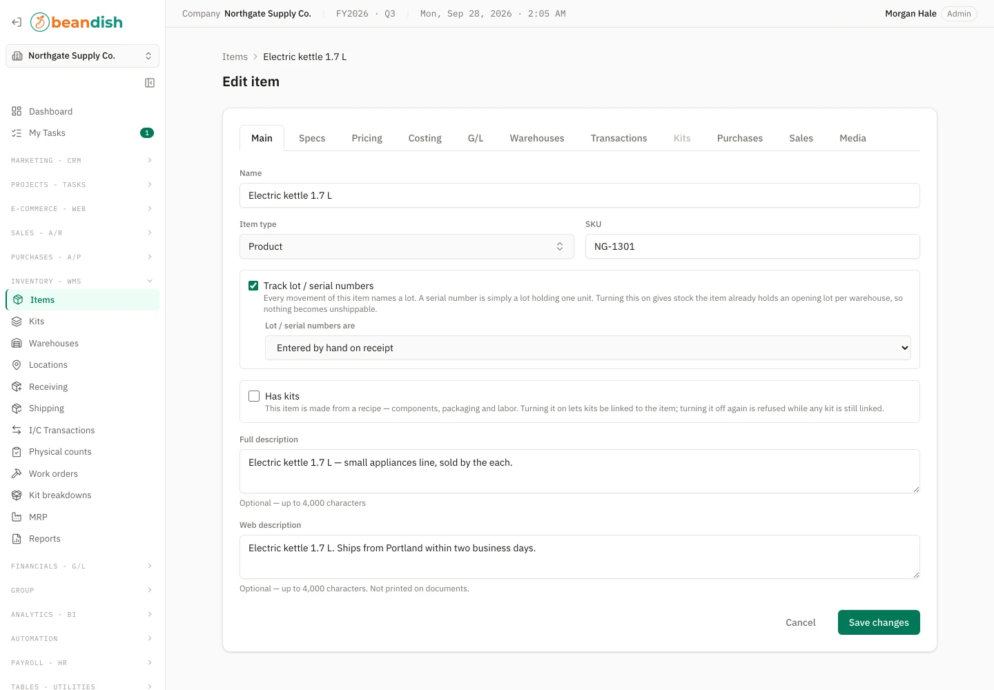 The item form on its Main tab: name, item type and SKU, the Track lot / serial numbers checkbox with how numbers are entered, the Has kits checkbox, and the full and web descriptions, with tabs for specs, pricing, costing, G/L, warehouses, transactions, kits, purchases, sales and media